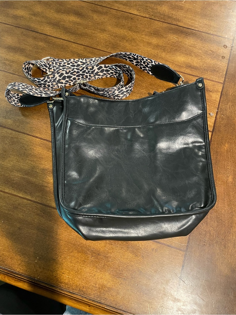 Black Leather Crossbody Bag with Leopard Strap